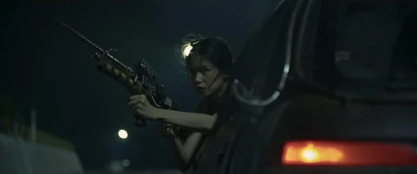 A woman aims a gun in a high - tension scene from "24 Jam Bersama Gaspar".