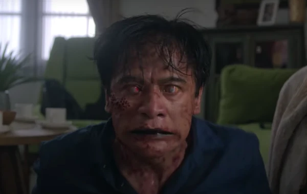 A bloodied and zombie - like man in "Abadi Nan Jaya".