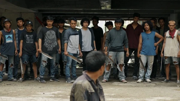 A man faces a gang in "Pertaruhan: The Series".